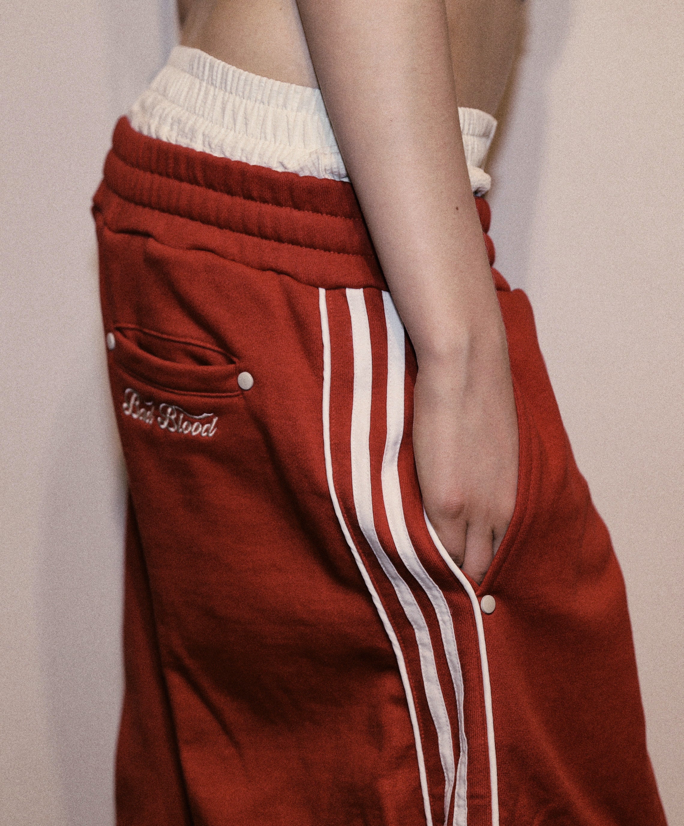 ★送料・関税込★BADBLOOD★Billy 2 Way Curved Jogger Trousers BAD BLOOD Billy 2 Way Curved Jogger Trousers - Red – SeoulSeoul