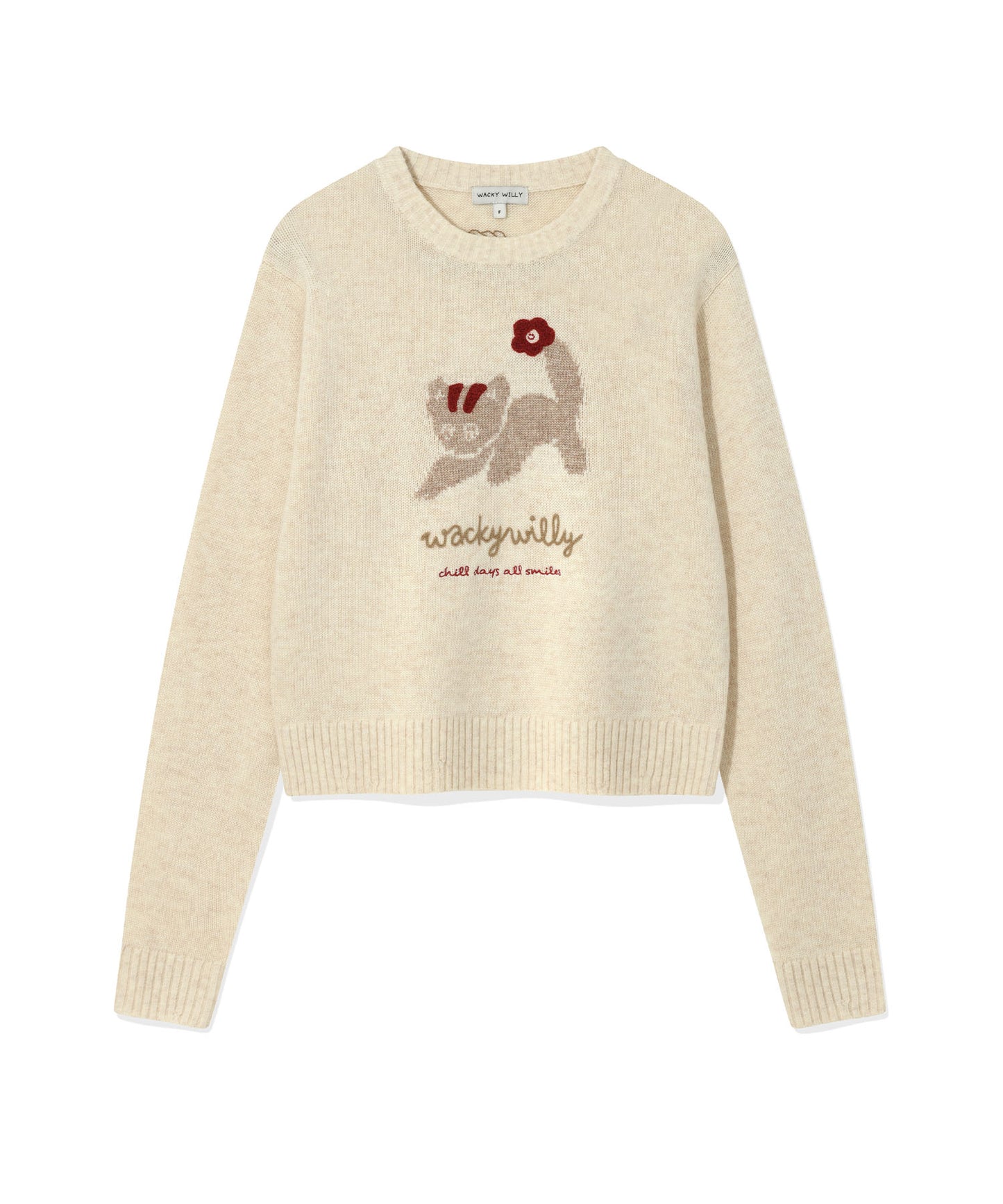 Cream-colored sweater with embroidered cat design and text on a white background