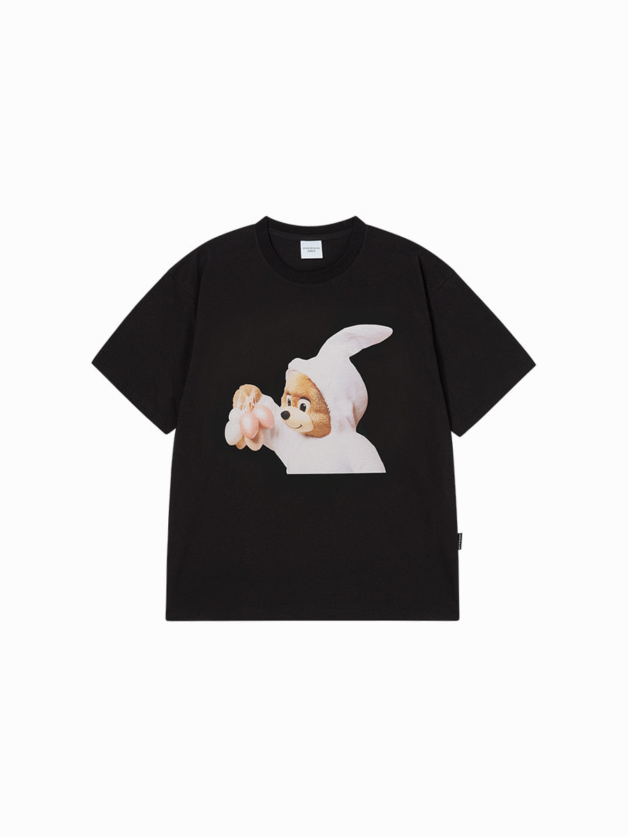 Black t-shirt with a cartoon character holding a heart on a white background