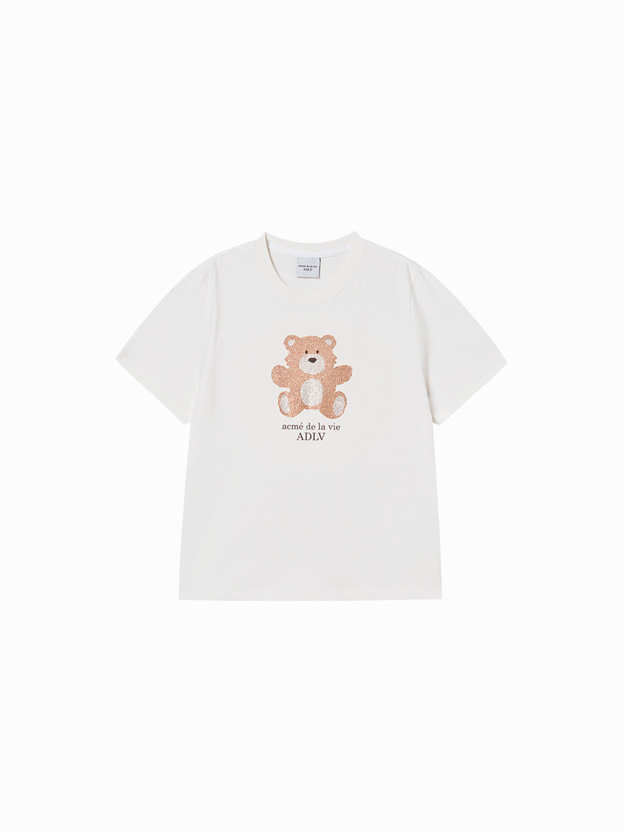 White t-shirt with a teddy bear graphic and text on a white background