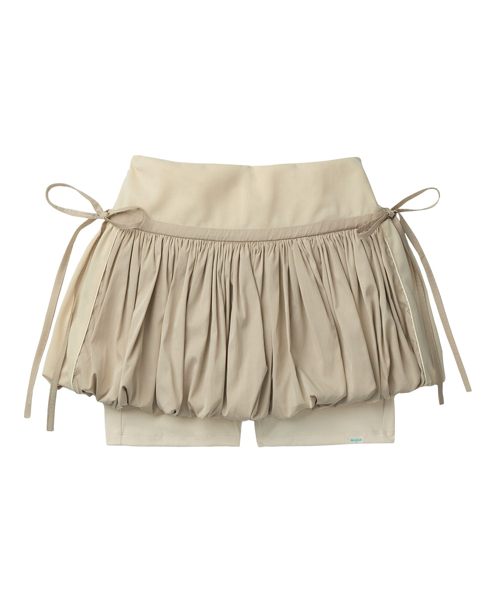 Beige shorts with ruffled bottom and drawstring on a white background