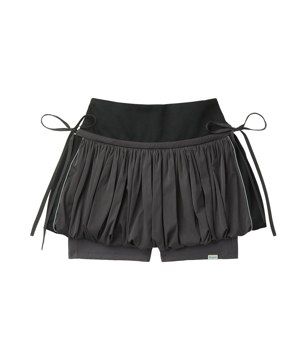 Black shorts with a pleated design and white stripes on a white background