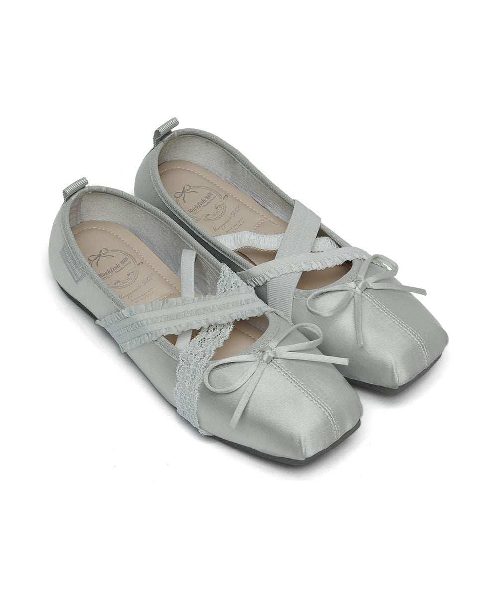 Pair of gray satin shoes with lace details on a white background