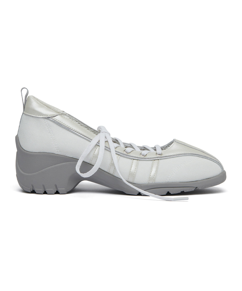 White athletic shoe with gray sole on a white background