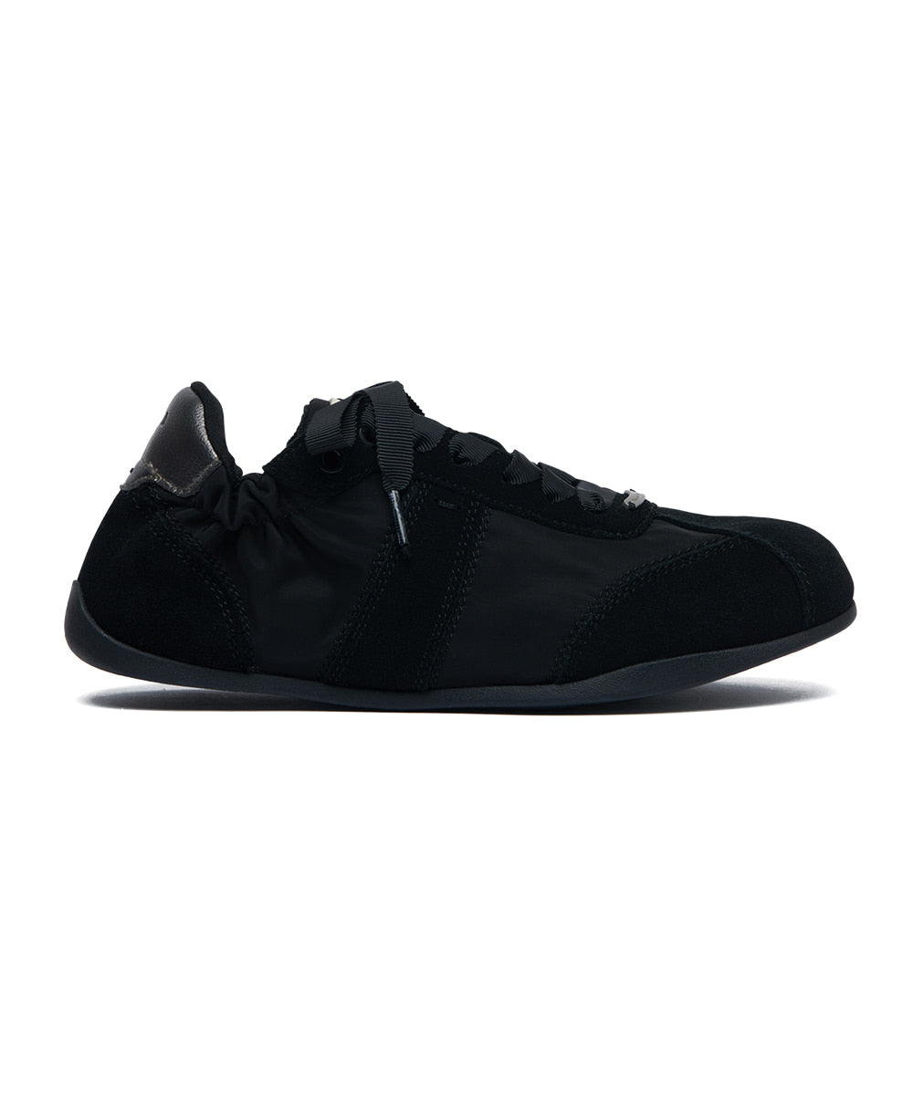 Black running shoe on a white background