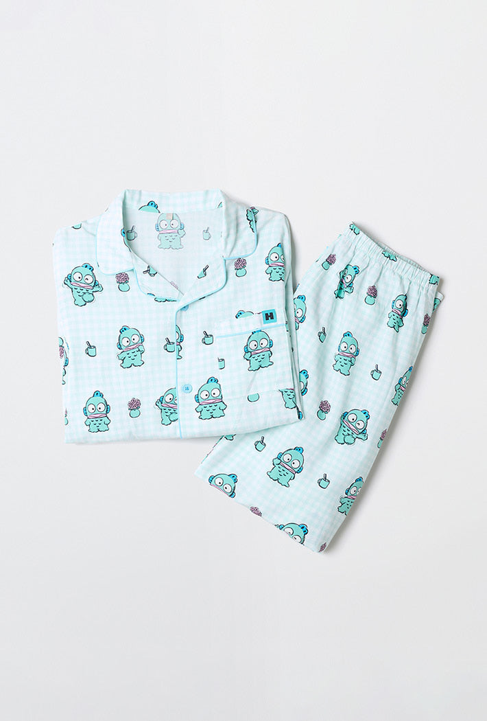 Children's pajama set with cartoon character design on a light blue background