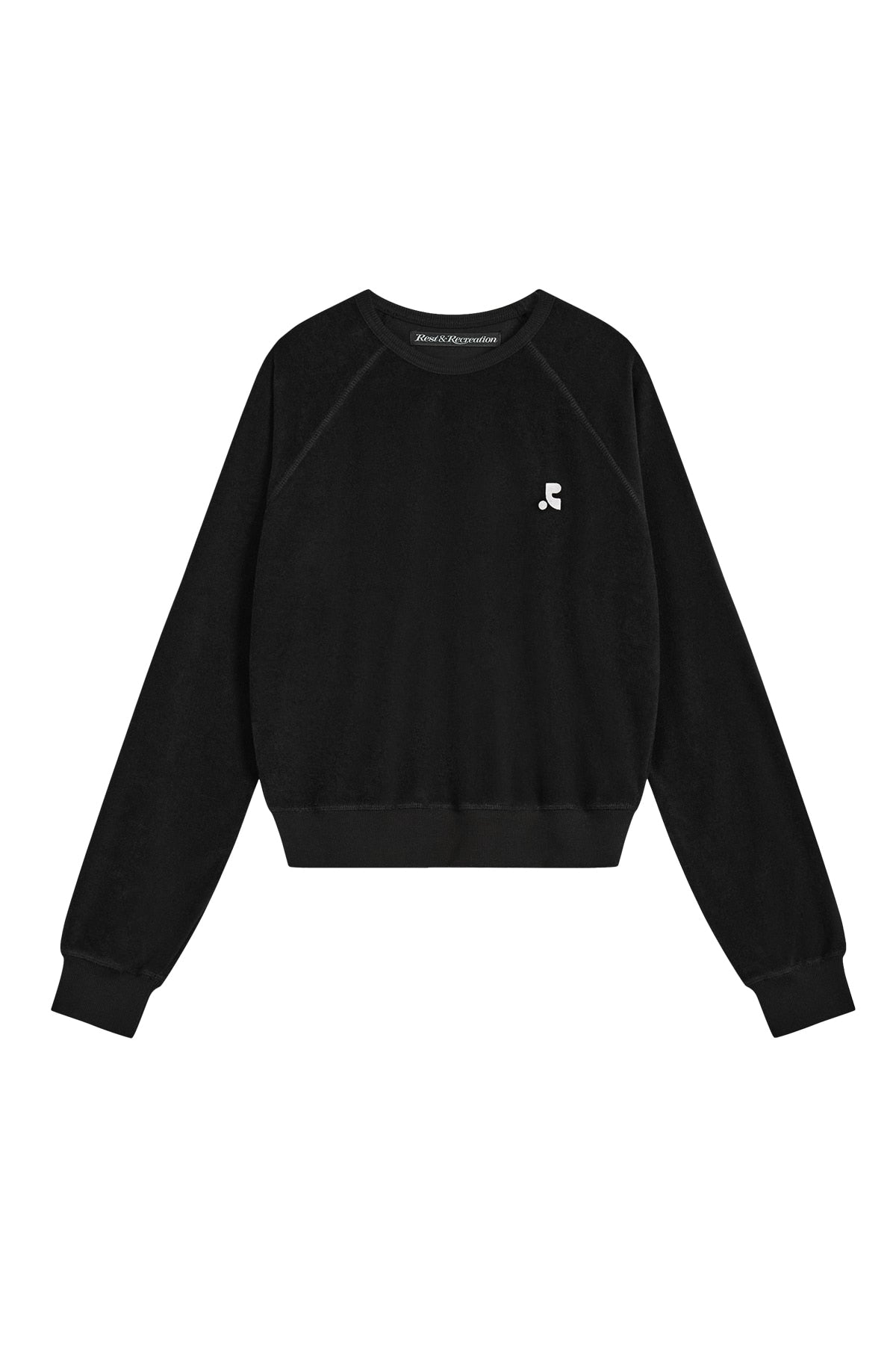 Black sweatshirt with a small white logo on a white background